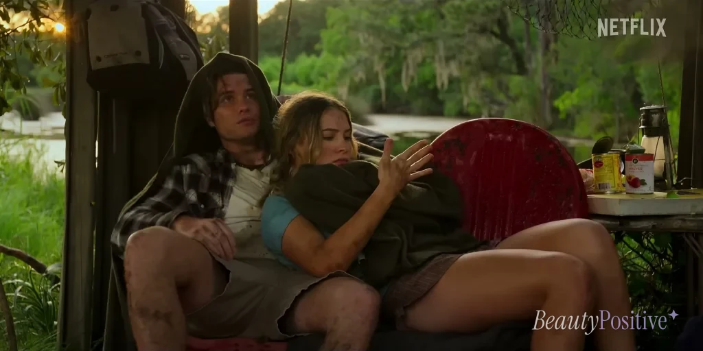 Rafe Cameron in a hoodie sitting with Sofia on a porch in the Outer Banks Season 5 trailer