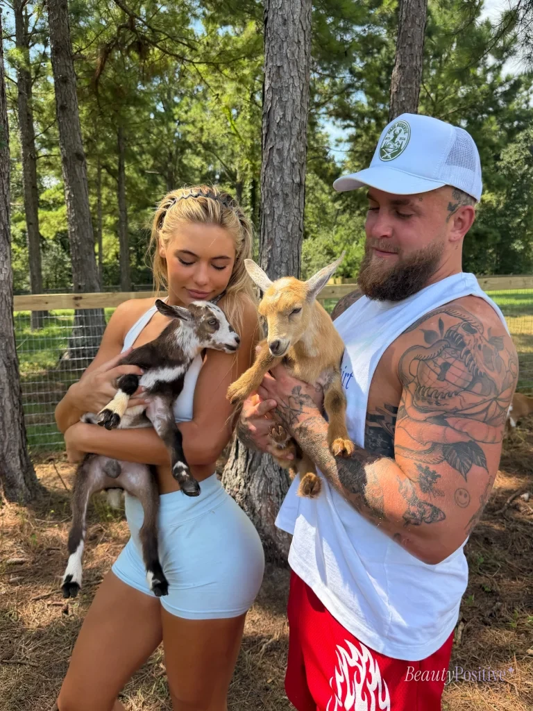 Jake Paul and Jutta Leerdam holding goats at their ranch
