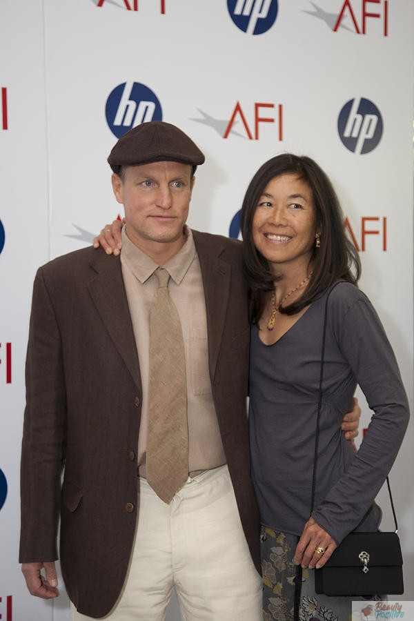 Woody Harrelson with his wife