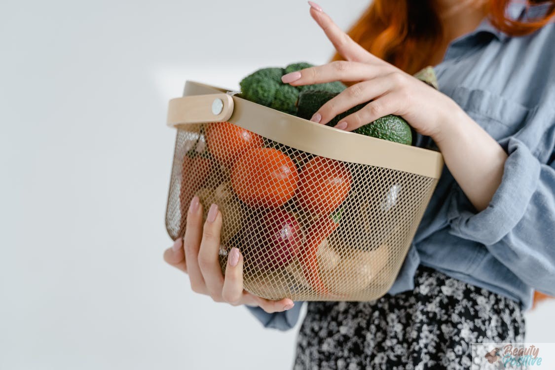 Woman carries a basket of vegetables