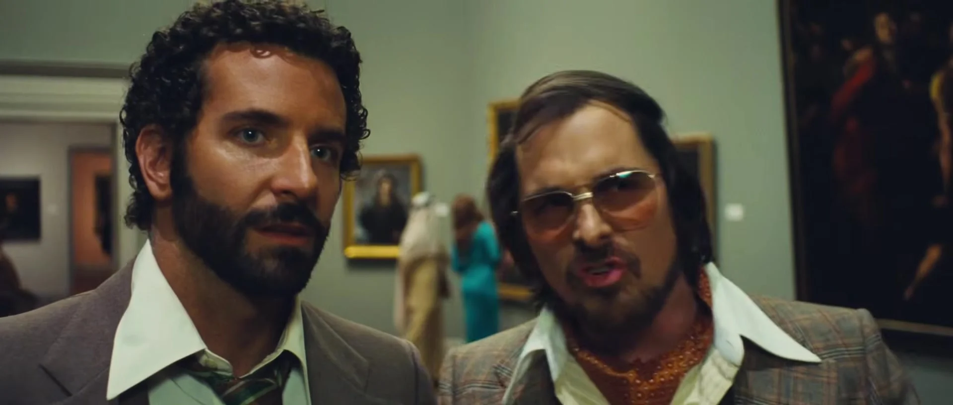 Christian Bale as Irving Rosenfeld with Bradley Cooper in American Hustle, 2013