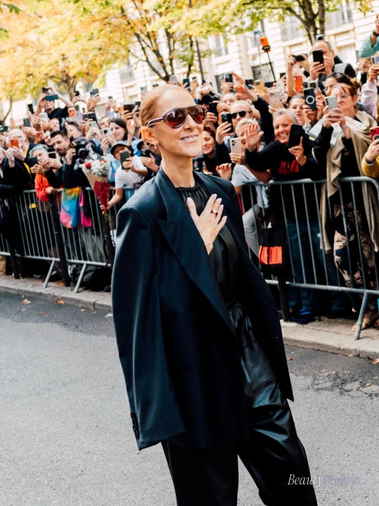 Dion greeting the crowd outside the arena during the Paris run.