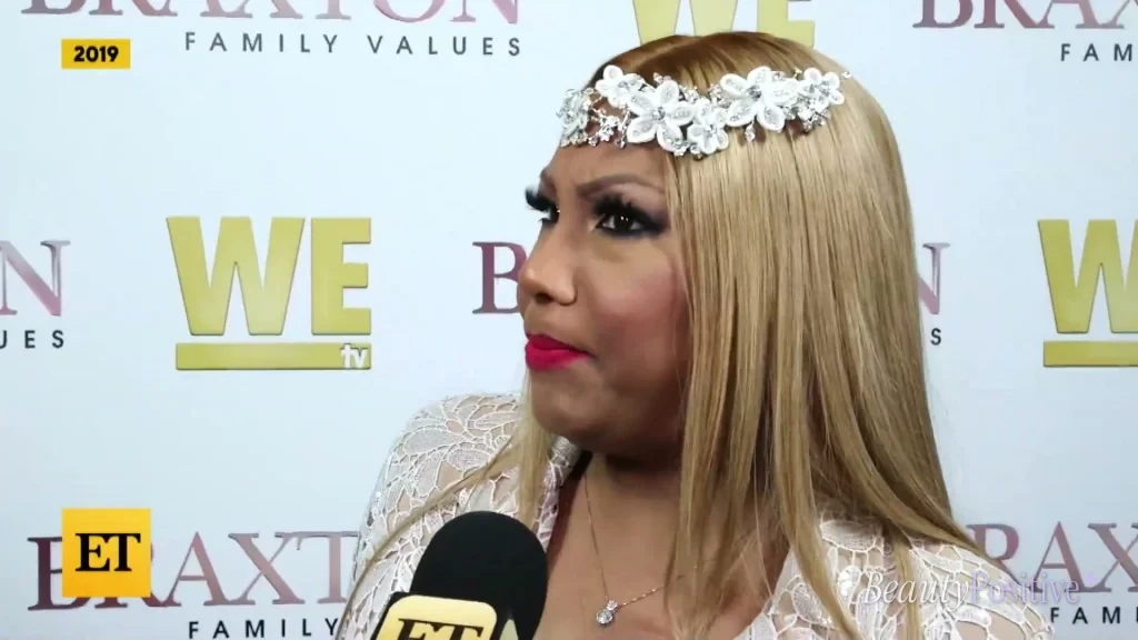 Traci at a Braxton Family Values event, as shown in Entertainment Tonight's report.
