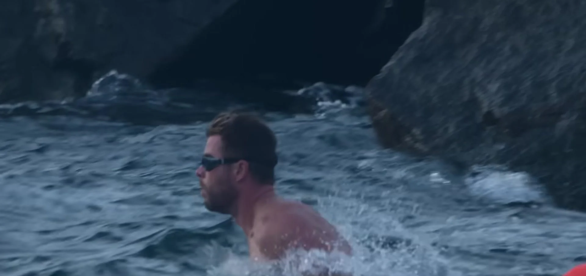 Chris Hemsworth swimming in the Limitless trailer (2022)