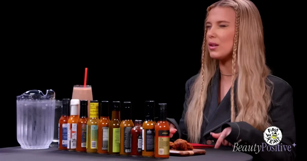 Brown on Hot Ones, facing the sauces.