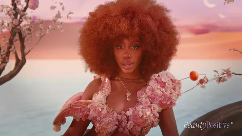 SZA in the Kiss Me More video, the song that won the Grammy she accepted on crutches.