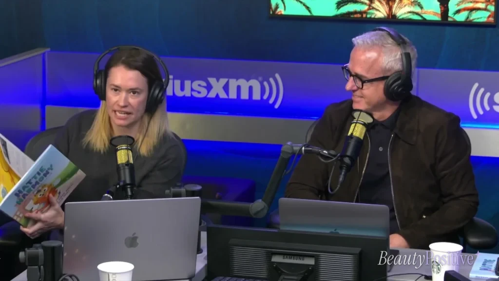 Jess Cagle holds up Hattie Harmony: Worry Detective, the book that got the couple talking.