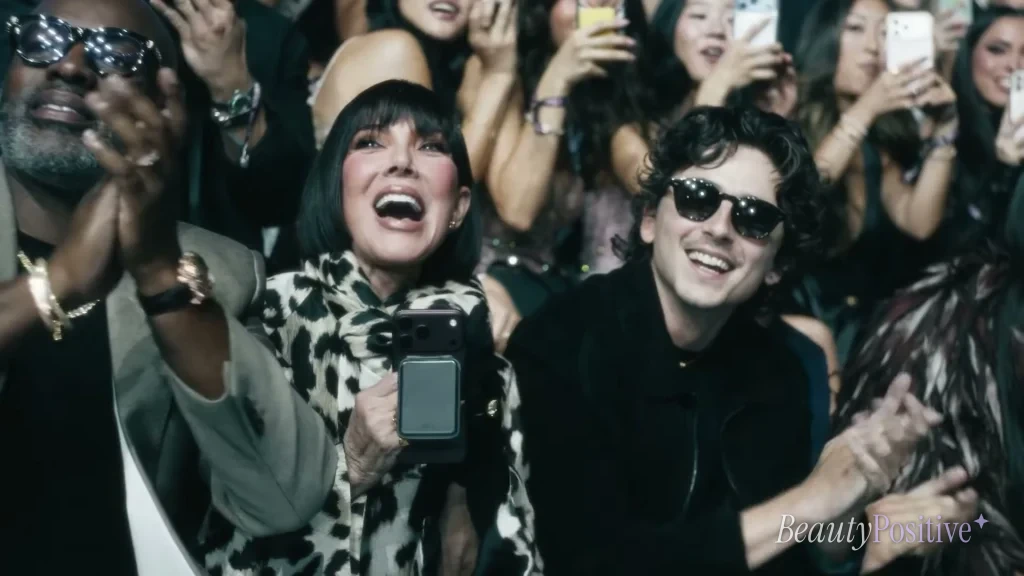 Corey Gamble, Kris Jenner and Timothée Chalamet cheering from the audience